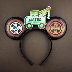 a mickey mouse ears headband with an image of a construction truck