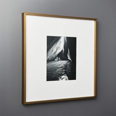 a black and white photo hanging on the wall