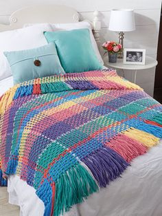 a crocheted blanket is shown with the video below it to show how to make an afghan