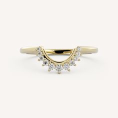 a yellow gold ring with three diamonds on it