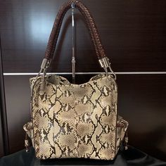 Nwt- Rare - A Collectors Dream Bag. Stunning Python Snake Skin Shoulder Bag By Michael Kors. Soft And Supple Snake Skin With A Brown Leather Braided Shoulder Straps, Outer Side Pockets, And Magnetic Closure. Wear It Casual With Jeans Or To Make Any Outfit Pop..!! Approximately 12”W X 10”H X 6”D With A 10” Drop. Purchased At Saks In 2010 And Never Used. Comes With Dust-Bag And Original Tags. This Is A Bag You Don’t Want To Miss Out On Owning.!!!! Designer Michael Kors Shoulder Bag With Leather Handles, Luxury Rectangular Hobo Bag With Braided Handles, Michael Kors Rectangular Satchel With Handle Drop, Michael Kors Shoulder Bag With Double Leather Handles, Michael Kors Double Handle Shoulder Bag With Leather Handles, Luxury Michael Kors Shoulder Bag With Leather Handles, Designer Rectangular Hobo Bag With Braided Handles, Michael Kors Satchel Shoulder Bag With Handle Drop, Michael Kors Shoulder Bucket Bag For Shopping