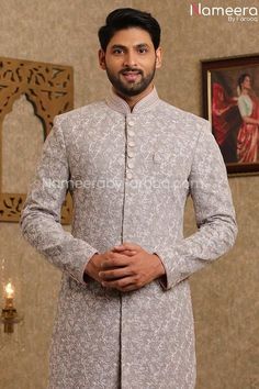 Latest Men's Wedding Sherwani for Groom Online in Stylish design embellished with zari, dabka thread and resham embroidery work. This ethnic sherwani set is made from fine quality material. Sherwani: A Grey Silk Sherwani is emblazoned with all over thread embroidery and has additional resham work. This sherwani made of bead, sequence and thread work on overall with Pearl brooch and silvery buttons. Wedding Sherwani fabric is raw silk. Pajama: Latest Men's Wedding Sherwani for Groom is paired wit Wedding Sherwani For Groom, Sherwani For Groom, Sherwani Groom, Resham Embroidery, Resham Work, Wedding Sherwani, Silk Pajama, Gray Silk, Thread Embroidery