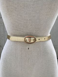 Vintage Karl Olsen gold tone leather belt, thin golden belt, made in Britain, Dorset fashion accessories, shiny metallic gold, designer belt This Vintage Karl Olsen Gold Tone Leather Belt is a timeless piece of British fashion accessory that exudes sophistication and elegance. Crafted with meticulous attention to detail, this belt features a thin golden belt made of leather and finished in a shiny metallic gold tone that adds a touch of opulence to any outfit. The designer behind this exceptional belt, Karl Olsen, is widely known for his mastery in creating stunning leather accessories that embody quality, style, and durability. With a keen eye for design, Olsen has established himself as one of Britain's most celebrated fashion accessory designers, with a reputation for delivering top-not Golden Belt, Designer Belt, British Fashion, Suspender Belt, British Style, Leather Accessories, Metallic Gold, Timeless Pieces, Leather Belt