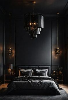 a bedroom with black walls and dark bedding, chandelier above the bed