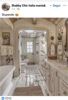 the bathroom is decorated in white and wood