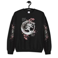 Japanese Blossom Sweatshirt, Cherry Blossom Moon Crescent Hoodie, Aesthetic Sweatshirt, Kawaii, Flowers Anime Unisex Sweatshirt A sturdy and warm sweatshirt bound to keep you warm in the colder months. A pre-shrunk, classic fit sweater that's made with air-jet spun yarn for a soft feel and reduced pilling. * 50% cotton, 50% polyester * Pre-shrunk * Classic fit * 1x1 athletic rib knit collar with spandex * Air-jet spun yarn with a soft feel and reduced pilling * Double-needle stitched collar, sho Kawaii Winter Sweatshirt With Graphic Print, Winter Kawaii Sweatshirt With Graphic Print, Kawaii Graphic Print Sweatshirt For Winter, Oversized Kawaii Sweatshirt For Streetwear, Kawaii Hooded Sweatshirt With Graphic Print, Spring Cotton Sweatshirt In Techwear Style, Spring Cotton Techwear Sweatshirt, Spring Techwear Cotton Sweatshirt, Spring Techwear Style Cotton Sweatshirt