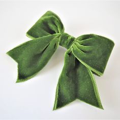 A perfect velvet bow hair clip to add to your vintage hairstyle or to give as a gift to a friend, teenager or child who loves to dress up their hair! You will receive a SMALL size 'green' colour velvet ribbon bow with individually hand beaded bow centre using a single row of iridescent bugle beads, hand stitched securely onto a silver finished metal hair clip that holds in place when snapped closed. Please note due to the small beads used these clips are unsuitable for very young children and ba Velvet Ribbon Bow, Vintage Hairstyle, Hair Clip Bow, Beaded Bow, Handmade Hair Bows, Bow Hair Clip, Bow Hair Accessories, Metal Hair Clips, Bow Clip