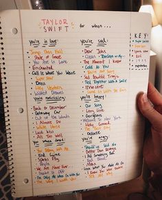 a person holding up a notebook with some writing on it and the words taylor swift written in different languages