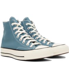 Item Info High-Top Canvas Sneakers In Blue. Rubber Cap Toe Lace-Up Closure Faux-Leather Logo Patch At Inner Side Rubber Midsole In Off-White Treaded Rubber Outsole In Brown Supplier Color: Deep Waters/Egret/Black Upper: Textile. Sole: Rubber. Blue Round Toe Sneakers For Fall, Blue Converse High-top Sneakers With Rubber Sole, Casual Blue High-top Sneakers With Rubber Toe Cap, Blue Casual High-top Sneakers With Gum Sole, Casual Blue High-top Sneakers With Gum Sole, Blue Lace-up Sneakers For Fall, Blue High-top Sneakers With Rubber Heel Cap, Fall Low-top Sneakers With Rubber Toe Cap, Blue Leather High-top Sneakers With Laces