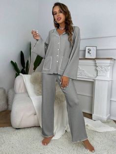 Elevate relaxation with our 2-piece Contrast Binding Casual Lounge Set. Effortless style meets comfort in this knitted polyester ensemble. Express yourself in a plain pattern with pocket and button front details. Loose fit & medium stretch ensure all-day ease. Long sleeves for extra coziness. Easy care with machine wash or dry clean. Unwind fashionably. Features: Style: Casual-Comfy Pattern Type: Plain Type: Pant Sets Details: Pocket, Contrast Binding, Button Front Sleeve Length: Long Sleeve Fit Daywear Sets With Pockets And Long Sleeves, Gray Loungewear Sets With Pockets, Casual Daywear Sets With Pockets, Casual Loungewear Sets With Button Closure, Relaxed Fit Loungewear Set With Pockets, Long Sleeve Loungewear Sets With Button Closure, Fall Loungewear Sets With Button-up, Casual Gray Sets With Pockets, Fall Loungewear Button-up Sets