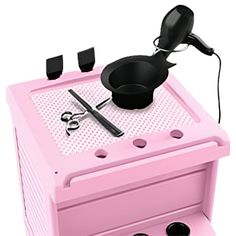 a pink stove top oven with utensils on it