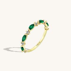 Discover this lovely Emerald Marquise Band Ring to add a right amount of color and sparkle to your look. Created with 14k solid gold and marquise cut emerald colored stones. Marquise Emerald Ring For May Birthstone, 14k Gold Marquise Cut Emerald Ring, Marquise Emerald Ring In Yellow Gold, Senior Rings, Emerald Birthstone Ring, Marquise Band, Marriage Rings, Twisted Band Ring, Celtic Knot Ring