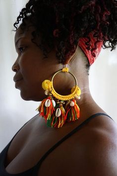 Big Brass Gold Hoop Red Gold Green Rasta Tassel Fringe Boho Beaded Statement Earrings Handmade Bohemian Hoop Earrings For The Beach, Bohemian Beaded Hoop Earrings For Festivals, Yellow Hoop Earrings For Festival, Bohemian Beaded Hoop Earrings For Beach, Bohemian Yellow Earrings For Beach, Bohemian Red Hoop Earrings With Colorful Beads, Multicolor Bohemian Hoop Earrings For Beach, Yellow Bohemian Hoop Earrings For Beach, Bohemian Multicolor Hoop Earrings For Beach