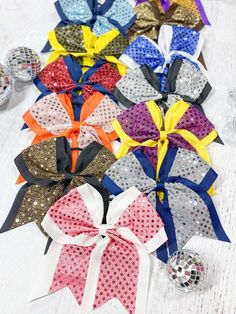 Get ready to shine with our Sequin School Spirit Cheer Bow! Featuring a fun and eye-catching design, this bow will definitely show off your team spirit. Perfect for pep rallies, games, and everyday wear, our bow will add a touch of sparkle to any outfit. Go team! How big is my bow?  Approx: 6.5" x 6" Ribbon Size: 3" Clip Type: Pony-o Diy Tutu Skirt, Pony O, Diy Tutu, Go Team, Hair Bow Holder, Cheer Bow, Bow Hair Accessories, Bow Holder, Boho Headband