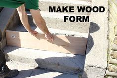 a man that is standing next to some stairs with the words make wood form on it