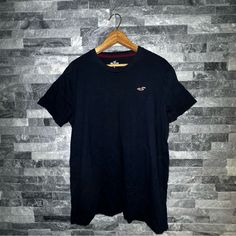 Navy Blue Hollister T-Shirt Size: Large Never Worn Without Tags Navy Casual Crew Neck T-shirt, Casual Navy T-shirt With Crew Neck, Casual Navy Crew Neck T-shirt, Navy Graphic Tee With Crew Neck, Navy Graphic Tee Shirt With Crew Neck, Navy Crew Neck Graphic Tee, Navy Graphic Tee With Short Sleeves, Navy Casual Crew Neck Top, Casual Navy Crew Neck Top