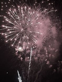 fireworks are lit up in the night sky