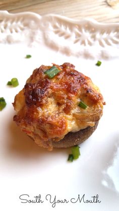 an eggplant and cheese muffin on a white plate