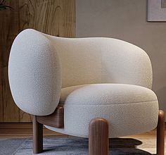 a white chair sitting on top of a wooden floor