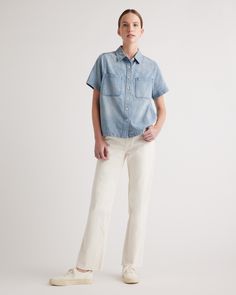 When easy does it, you need this Distressed Denim Short Sleeve Shirt. A total classic, it features a full button front, chest pockets, and a subtly distressed wash. The boxy fit feels like a modern update and looks amazing over figure-skimming skirts and pants.  | Quince | Women's Distressed Denim Short Sleeve Shirt in Blue, Size Small, Cotton Light Wash Relaxed Fit Denim Top, Relaxed Fit Medium Wash Denim Top, Summer Button-up Washed Blue Jeans, Washed Blue Button-up Jeans For Summer, Summer Washed Blue Button-up Jeans, Relaxed Fit Denim Top With Buttoned Pockets, Light Wash Denim Top With Buttoned Pockets, Casual Button-up Relaxed Fit Jeans, Denim Tops With Pockets And Straight Leg