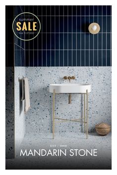 a white sink sitting under a bathroom mirror next to a blue tiled wall and floor