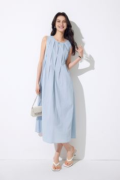 Simple & Casual Summer Style Embrace simplicity and comfort with our Casual Summer Pleat Textured Blue Tank Midi Dress. This baby blue dress features a sleeveless, round-neck design and a relaxed H-line silhouette. The wide pleats from the neckline and tiered layers add a touch of elegance. The unique textured fabric is breathable, skin-friendly, and maintains its shape. Complete with side pockets for functionality, this dress is perfect for casual summer outings. Style #: WWAJ352 Summer Pleated Light Blue Maxi Dress, Summer Light Blue Pleated Maxi Dress, Light Blue Pleated Maxi Dress For Summer, Light Blue Cotton Sleeveless Dress For Spring, Blue Pleated Maxi Dress For Summer, Spring Light Blue Cotton Sleeveless Dress, Light Blue Casual Maxi Dress For Daywear, Casual Light Blue Maxi Dress For Daywear, Light Blue Pleated A-line Dress