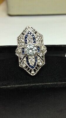 an antique diamond and sapphire ring on display