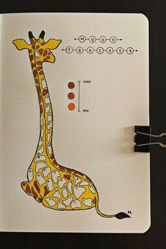 a drawing of a giraffe is shown on a notebook