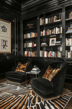 a living room filled with black furniture and bookshelves