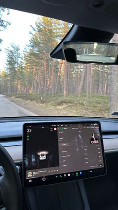 the dashboard of a car with an image of a person driving in front of it