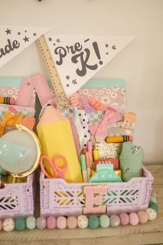 a basket filled with lots of different items on top of a wooden table next to a clock