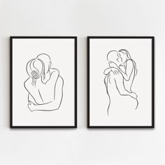 two black and white framed art prints with one woman holding the other's head