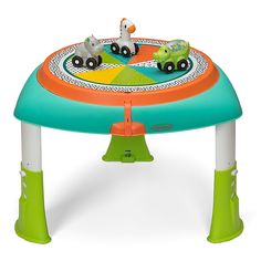 a small child's activity table with an animal theme on the top and green legs