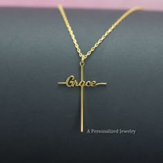 "Express your faith with a Solid Sterling Silver or 18K Gold Plated Grace Cross Necklace.  The minimalist Grace script necklace has a simple yet elegant look! Made in NC, USA, and shipped the next day! ✝️Material: Sterling Silver ✝️Finish: High Polished Rhodium or 18K Gold plated ✝️Nickel Free, Tarnish Resistant ✝️Dimensions:             Size: Height: 27 mm (1.06\").                     Width: 14 mm (0.55\") ✝️The chain length: 16, 17, 18, or 20 inches Each item comes in a gift box, ready to be gifted! 😊 ✝️ We offer this pendant in a larger size (41 mm / 1.6\"). Please check our home page. A Personalized Jewelry (APJ) is a branch of Minique Jewelry.  https://www.etsy.com/shop/MiniqueJewelry" Women’s Cross Necklace, Elegant Cross Pendant Necklace For Gift, Cross Necklace Womens, Necklace For Women, Cross Necklace Christian, Grace Necklace, Cross Pendant Necklace Woman, Name-engraved Cross Pendant Jewelry Gift, خواتم خطوبة