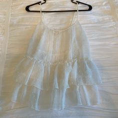 See Through Tank. Brand New, Never Worn White Ruffled Camisole For Beach, White Ruffled Camisole With Spaghetti Straps, White Ruffled Summer Camisole, White Ruffled Camisole, White Ruffled Camisole For Vacation, White Ruffled Cami Tank Top, White Ruffled Camisole For Day Out, White Ruffled Camisole For Brunch, White Ruffled Camisole For Spring