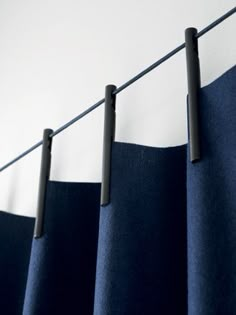 blue curtains hanging on a clothes line