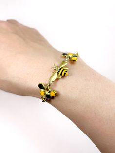 ● Bee and beehives bracelets are made of jewellery gread brass and white bronze. Bottom and beehives're enamelled by hand with care. The whole bracelet length 21 inches. If you need other length of the bracelet please leave message to us during the checkout. We'll adjust with no additional charges.  ● All the items I've made are the ture color of brass. There is no plating, so you can polish it whenever you want. But DO NOT polish the colour parts. Colour can fade.  ● Your jewellery will be packaged in an airtight zippered bag which is placed inside a MAFIA brand cloth bag. Everything will be enclosed in a shipping box.  ● This item is sent from Bangkok - Thailand Handmade Wristlet, Bee Jewelry, Bangkok Thailand, Bee Hive, Chain Link Bracelet, Accessories Bracelets, Silver Bracelets, Cloth Bags, Link Bracelets