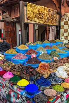 an outdoor market with lots of different types of food