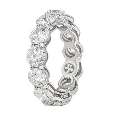 This Remarkable Eternity Band Features 13 Perfectly Matched Round Diamonds That Have A Total Weight Of 6.54 Carats. The Band Features 13 Round Brilliant Diamonds That Are D/E In Color & SI1 In Clarity. The Diamonds are Set Throughout the Whole Platinum Band So That The Diamonds are Seen Through All Angles. This Ring Is Currently Available In A Size 6 But Can Be Ordered In Any Size. Please Call Us For Specific Finger Size Prices. Luxury Gia Certified Round Eternity Band, Round Diamond Eternity Band, Diamond Eternity Band, Platinum Metal, Eternity Band Diamond, Diamond Eternity, Eternity Band, Brilliant Diamond, Diamond Clarity