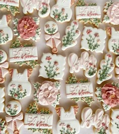 many decorated cookies are displayed on a table