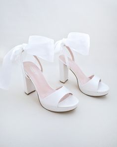 "Satin block heel sandal with wrapped satin/sheer ankle tie. Elegance and classic inspired wear for your special day. Perfect for brides, bridesmaids, prom night, date night, and definitely a highlight on every special occasions. DETAILS: HEELS: 4 inches COLORS AVAILABLE: Ivory, White and Light Blue UPPER: Synthetic upper and lining MATERIALS: Manmade outsole ORIGIN: Imported STYLE NAME: ATHENA  Not sure of which size to purchase? Shoes measurements are as follow: (Please note measurements taken the length of inside of shoe from toe to heel) SIZE 5 - 9\" SIZE 6 - 9.25\" SIZE 7 - 9.5\" SIZE 8 - 10.875\" SIZE 9 - 10.25\" SIZE 10 - 10.50\"  SIZE 11 - 10.875\" Please note all these infos are intended for general reference and are to be used as a guide only. Age and size will vary.  - We DO NOT Block Heels Wedding, Shoes Wedding Heels, Shoes Bridesmaid, Night Date, Tie Women, Platform Block Heels, Bridesmaid Shoes, Women's Robe, Wedding Sandals