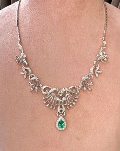 Elegant and exquisite, Victorian style necklace with diamonds in 18Kt white gold in symmetrical floral design, beautifully handcrafted. The center sits a sparkly, enchanting natural Colombian Emerald in pear cut, the emerald is 0.70 ct and has stunning luster, it is surrounded with a halo of natural brilliant white diamonds weight approx 0.2 ct. The necklace is a true beauty, ravishing and gleaming, the floral part was made with 9 hinged section, with millegrain setting details and dainty diamonds, each leafy & floral part was made separately, for better movement and easy to wear. The Chain is solid 18Kt White Gold box chain with strand hook clasps at back. Length : 38 CM Diamond : 0.7 TCW approx Emerald : 0.7 Ct  Total Weight : 23.9 G Victorian Necklace, Big Diamond, Colombian Emeralds, Gold Box, Emerald Necklace, Bespoke Jewellery, Choker Necklaces, Style Necklace, Pear Cut