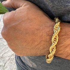 Mens twisted braided rope chain bracelet. Measures 9" inches long x 10mm thick. 14k gold plated finish over alloy metal. Nice weight to it at approx 40 grams. Stylish and secure lobster claw clasp. Looks like a $1000 solid gold piece. 100% FREE SHIPPING in USA. Order now! Braided Rope, Gold Piece, Twist Braids, Rope Chain, Lobster Claw, Chain Bracelet, Solid Gold, Gold Plate, Plating