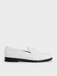 Brighten up your everyday ensemble with these penny loafers in striking optic white. They feature all the classic details, from the effortless slip-on style to the decorative slotted leather strips across the vamps. Subtle ruching along the sides adds a touch of texture, while the low block heels offer just the right amount of lift for busy, on-the-go days. Pu Heels, Charles Keith, Low Block Heels, The Low, The Vamps, Penny Loafers, Trending Shoes, Loafer Flats, Penny