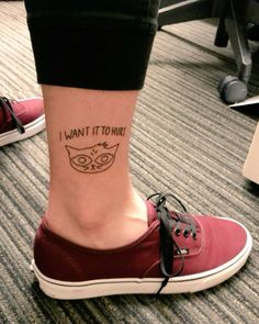 a woman's foot with a cat tattoo on her left ankle and the words i want