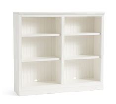 a white bookcase with three shelves on each side