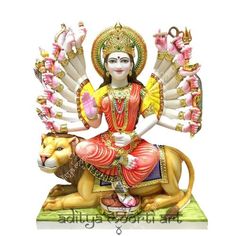 a statue of the hindu god sitting on top of a lion's body and surrounded by other animals