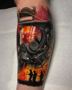 a man with a tattoo on his arm that has an image of a motorcycle and fire