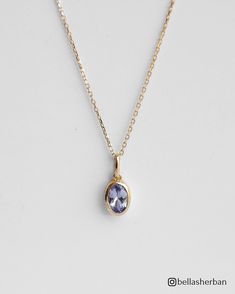 Enjoy the mesmerizing beauty of our 14K Solid Gold Oval Tanzanite Pendant Necklace, a stunning pendant that radiates elegance, refinement, and  grace.  This 14K solid gold necklace includes a breathtaking oval tanzanite--a gemstone recognized for its unique lavender color, which represents transformation and spiritual growth. The dainty design of the pendant adds a touch of modern elegance, making it a versatile and essential addition to your jewelry collection. Details * 14K Solid Gold  * 4x6mm Natural Oval-Cut Tanzanite * Removable Pendant  * Chain length: 40cm + 3cm (16" + 1.18") * Ready to ship in 14K yellow gold Processing time: The necklace is ready to ship in 14k yellow gold. If you wish to order it in 14K white gold, please note that the production process will take approximately 4 Elegant Oval Pendant Birthstone Necklace, Elegant Tanzanite Necklace As Gift, Elegant Tanzanite Necklace For Gift, Elegant Tanzanite Necklace Gift, Elegant Oval Birthstone Necklace, Classic Tanzanite Necklaces With Diamond Cut, Elegant Oval Tanzanite Necklaces, Elegant Tanzanite Birthstone Necklaces, Elegant Tanzanite Necklaces For Anniversary