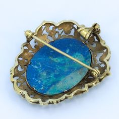 "Beautiful floral detailing in this vintage convertible brooch / pendant. Beautifully crafted 10k Gold setting with large polished lapis cabochon. Fold away bale. This piece has no markings. Chain not included - Need one? Just ask, we can help. Length of Brooch 1.80\" Length of pendant including bale 2.0\" Width of Brooch 1.54\" Lapis measurements 29.5x23 mm Weight of piece 0.48 Oz (13.62 g) CHAIN NOT INCLUDED - FOR DISPLAY ONLY This item is vintage. It has been cherished, worn, and preserved by Victorian Pendant Brooches With Cabochon, Yellow Gold Cabochon Pendant Brooch, Antique Pendant Brooch With Cabochon, Antique Pendant Brooches Hallmarked, Vintage Lapis Lazuli Jewelry, Antique Pendant Brooch Hallmarked, Antique Oval Cabochon Brooches, Antique Oval Gemstone Brooches, Antique Hallmarked Pendant Brooches